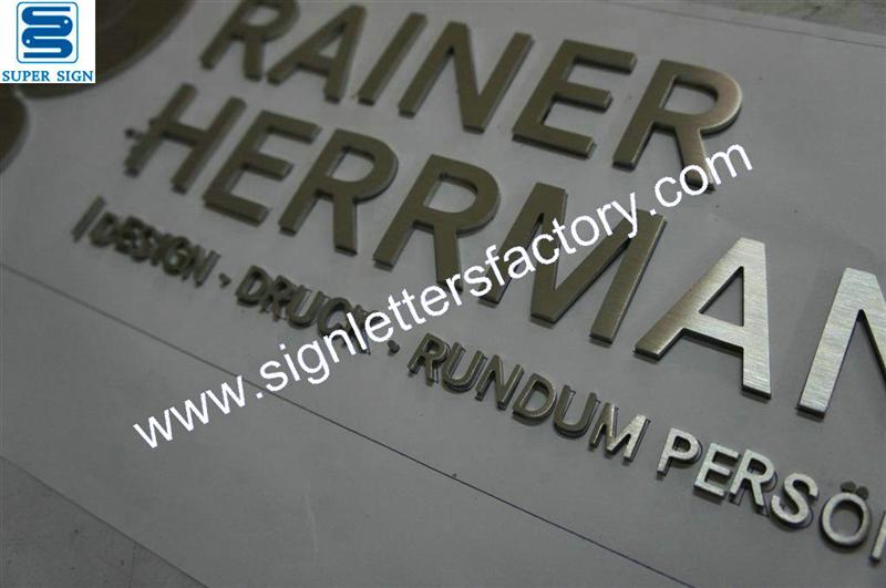 brushed stainless steel company sign